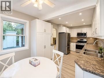 Ancaster apartment for rent - A well-lit kitchen with a table and chairs.