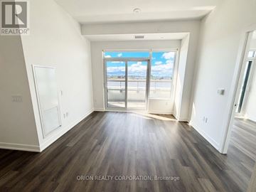 Vaughan (Vaughan Corporate Centre) condo for rent - A room with a view of the beach through a large window.