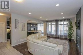 London North (North C) apartment for rent - A living room with a white couch and a television on the wall.