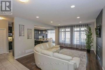 London North (North C) apartment for rent - A living room with a white couch and a television on the wall.