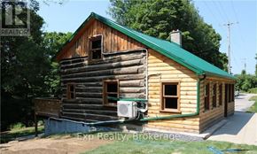Prince Edward County (North Marysburg Ward) apartment for rent - A wooden house with a green roof is for sale.