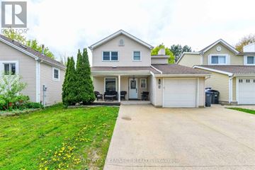 Brampton (Heart Lake West) apartment for rent - A house with a driveway and a garage is shown in the image.