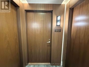 Milton (De Dempsey) condo for rent - A wooden door with the number 512 on it.
