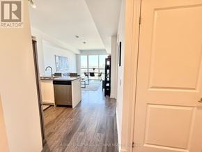 Milton (De Dempsey) condo for rent - A kitchen with a dishwasher and a fridge.