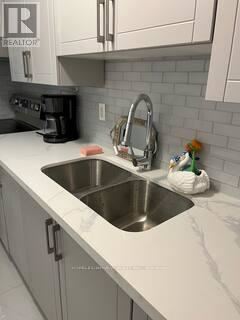 Toronto (Willowdale East) apartment for rent - A kitchen with a sink and a coffee maker.