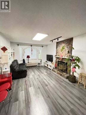 Columbia Valley apartment for rent - A living room with a fireplace and a TV.