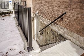 Pickering (Amberlea) apartment for rent - A black metal railing on a concrete staircase.