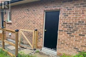 Vaughan (Islington Woods) multi-family for rent - A black door is on a brick house.