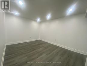 Toronto (Elms-Old Rexdale) apartment for rent - A room with wooden flooring and white walls.