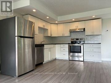 Hamilton (Sunninghill) apartment for rent - A modern kitchen with stainless steel appliances and white cabinets.