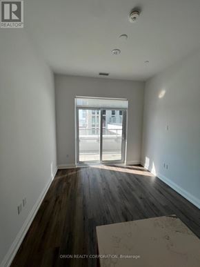 Vaughan (Vaughan Corporate Centre) condo for rent - A room with a sliding glass door leading to a balcony.