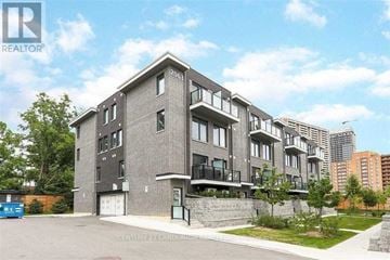 Toronto (Weston) townhouse for rent - A modern apartment building with the number 2063 on the front.