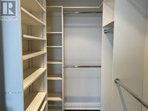 Toronto (Annex) condo for rent - Empty white shelves in a pantry.