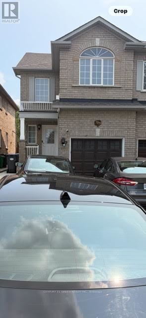Mississauga (Meadowvale Village) apartment for rent - A car is parked in front of a house with a sign that says "Crop".