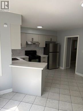 Mississauga (Meadowvale Village) apartment for rent - A kitchen with white cabinets and appliances.