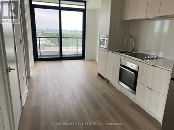 Mississauga (Cooksville) condo for rent - A kitchen with a stainless steel oven and wooden flooring.