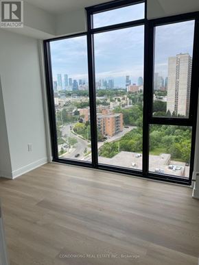 Mississauga (Cooksville) condo for rent - A room with a view of the city through large windows.