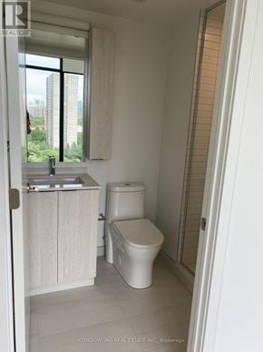 Mississauga (Cooksville) condo for rent - A white bathroom with a toilet and sink.