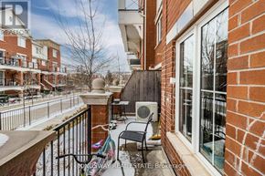 Oakville (Ro River Oaks) townhouse for rent - A balcony with a chair and a table is shown.