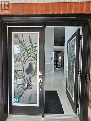 Brampton (Sandringham-Wellington) apartment for rent - A glass door with a black frame and a picture of a stained glass window on it.