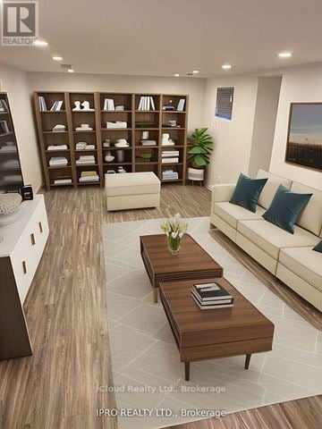 Caledon (Bolton West) apartment for rent - A modern living room with a white sofa, wooden coffee table, and a bookshelf filled with books and decorative items.