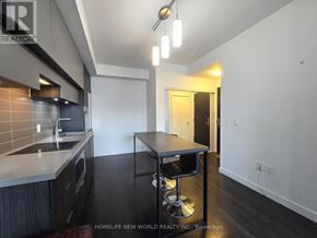 Toronto (Mount Pleasant West) condo for rent - A kitchen with a table and chairs in the middle of the room.