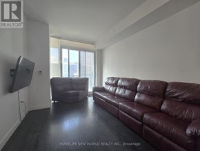 Toronto (Mount Pleasant West) condo for rent - A living room with a brown leather couch and a flat screen TV mounted on the wall.