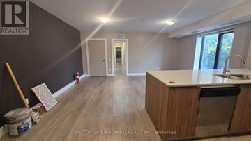 Toronto (Yorkdale-Glen Park) condo for rent - A kitchen with a countertop and cabinets is under construction.