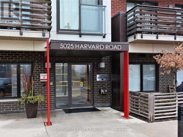 Mississauga (Churchill Meadows) condo for rent - The front of a building with a sign that reads 5025 Harvard Road.