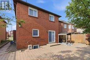 Pickering (Brock Ridge) apartment for rent - A red brick house with a grey door and windows.
