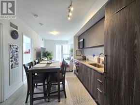 Toronto (Agincourt South-Malvern West) condo for rent - A modern kitchen with dark wood cabinets and a dining table with chairs.