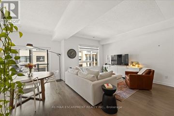 Burlington (Lasalle) townhouse for rent - A living room with a white couch and a wooden floor.