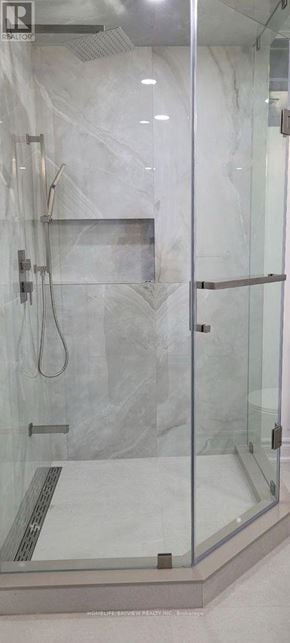 Bradford West Gwillimbury (Bradford) apartment for rent - A shower with a glass door and a marble wall.