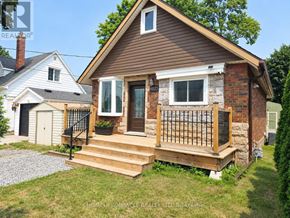 Niagara Falls (Dorchester) apartment for rent - A house with a brown roof and a brick chimney is for sale.