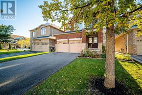 Brampton (Bram East) apartment for rent - A house with a tree in front of it.