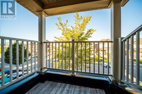 Brampton (Bram East) apartment for rent - A balcony with a view of a street and houses.