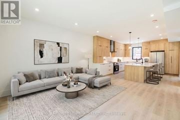 Toronto (Dovercourt-Wallace Emerson-Junction) duplex for rent - A modern living room with a grey sofa and a coffee table.