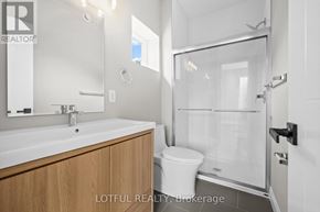 Ottawa apartment for rent - A bathroom with a sink, toilet and shower.