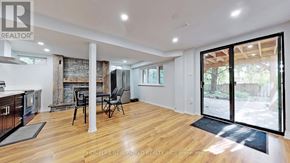 Mississauga (Erin Mills) apartment for rent - A modern living room with wooden floors and a fireplace.