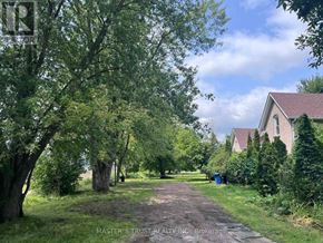East Gwillimbury apartment for rent - A tree-lined pathway leads to a house.