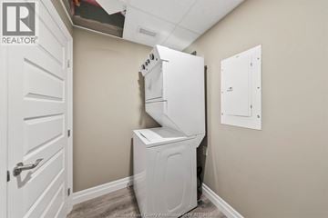 Windsor condo for rent - A white dishwasher is in a small kitchen.