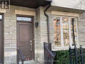Markham (Commerce Valley) townhouse for rent - A brown door with a number 241 on the wall above it.