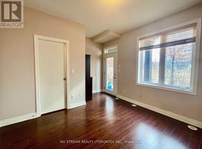 Markham (Commerce Valley) townhouse for rent - A room with wood flooring and a window with blinds.