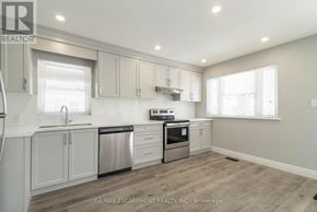 Hamilton (Westcliffe) apartment for rent - A kitchen with white cabinets and a stainless steel dishwasher and oven.