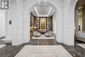 Oakville (Oo Old Oakville) condo for rent - A luxurious hallway with a marble floor and elegant furniture.