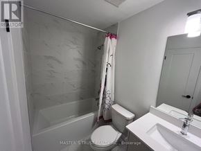 Vaughan (Uplands) townhouse for rent - A bathroom with a toilet, sink, and shower.