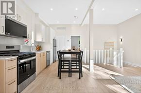 Toronto (Banbury-Don Mills) apartment for rent - A modern kitchen with a dining table and chairs.