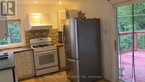 London North (North G) apartment for rent - A kitchen with a refrigerator, stove, and oven.