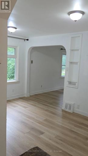 London North (North G) apartment for rent - A white room with a doorway leading to another room.