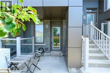 Waterdown townhouse for rent - A patio with a table and chairs is visible.